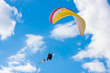 paraglider in blue sky