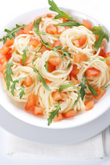 Pasta with tomato and rucola
