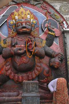 Woman praying at Kali in Kathmandu , Nepal 1.