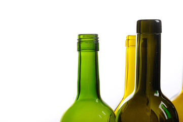 Many empty green wine bottles isolated on white background