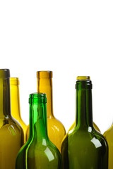 Many empty green wine bottles isolated on white background