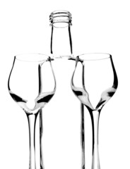 Bottle and glasses on white