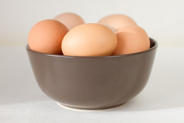Eggs in a brown bowl