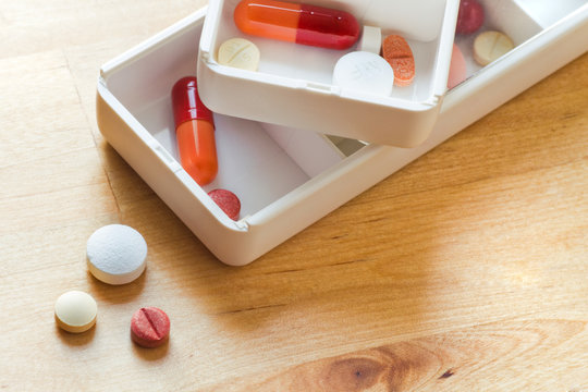 Sorting Pills In Pillbox For Daily Use