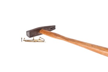 A small rusty list hammer and some nails