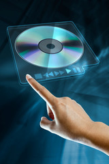 a woman hand press the option eject cd or dvd
