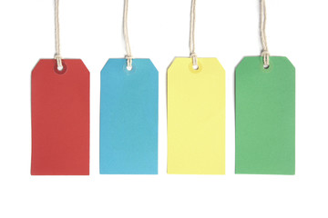 Four price or luggage tags coloured red, blue, yellow and green