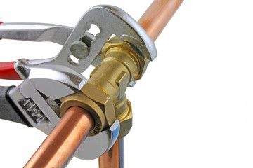 wrenches on plumbers fitting