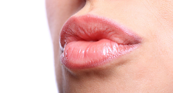 Young woman's glossy lips