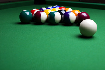 Pool game balls against a green