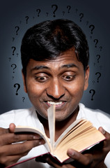 Indian man reading book