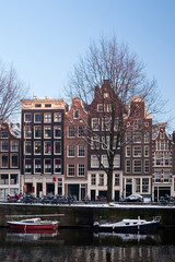 Fototapeta na wymiar Amsterdam canals and typical houses