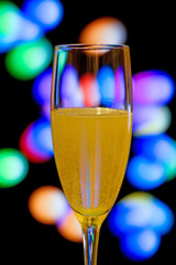 champagne glasses on color background