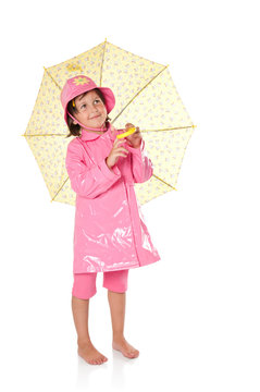 Little girl with raincoat and umbrella