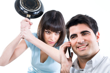 Woman trying to kill her husband with a pan