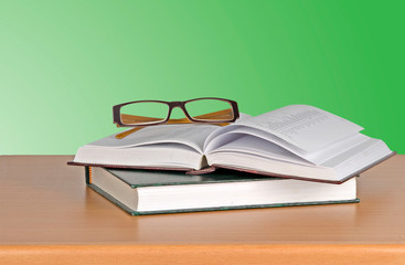 Eyeglasses and books