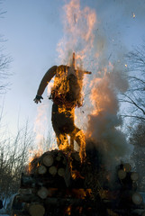 Mardi gras winter effigy in spring fire