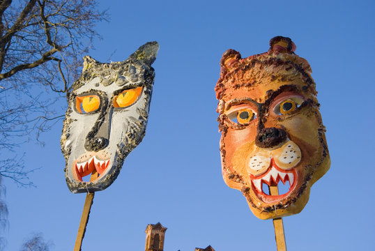 two Mardi Gras masks on sky background