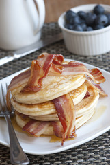 Pancakes with crispy bacon and syrup