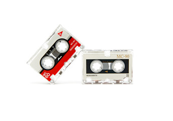 two audio cassettes on a white background.