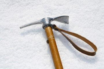 ax hook firmly fixed in a wall of ice in high mountains