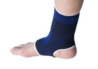 senior with ankle support on a white background