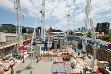 Fototapeta na wymiar construction site with a few cranes at early stage