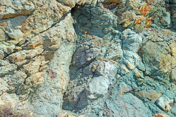 Green and orange volcanic stone, nature background