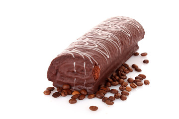 Cake and coffee beans isolated on white