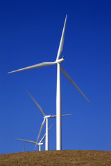 Wind-powered generator against the blue sky