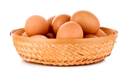 Eggs in basket isolated on white