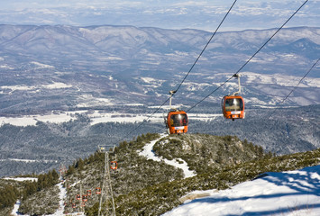 Cable car over mountain landscape. Ski resort Borovets, Bulgaria