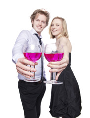 Young couple toasting with pink drink