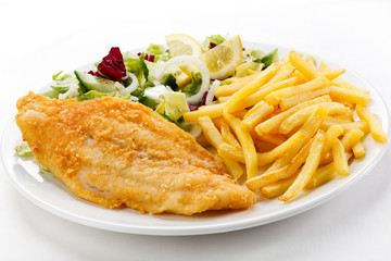 Fish dish - fried fish fillet, French fries  with vegetables © Jacek Chabraszewski