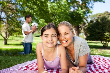 Mother and daughter having fun in the park