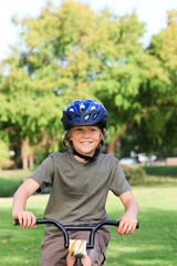 Obraz premium Little boy with his bike