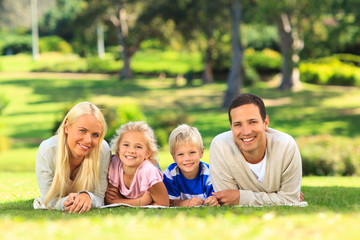 Fototapeta premium Family lying down in the park