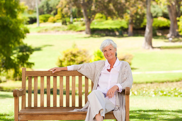 Fototapeta premium Senior woman on a bench