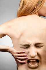 Woman suffering from kidneys or back pain
