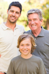 Obraz premium Family looking at the camera in the park