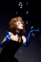 woman mime with soap bubbles.