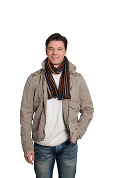 Adult man with winter clothes standing on white background