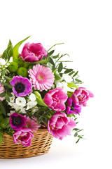 Obraz na płótnie Canvas colorful flowers in a basket