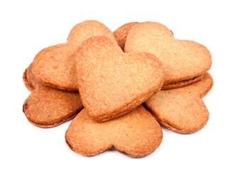 A pile of heart shaped biscuits filled with marmelade isolated o