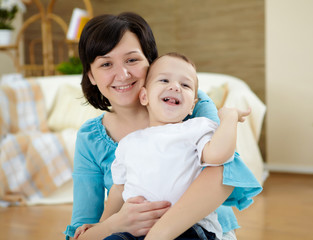 mother and son at home on the floor