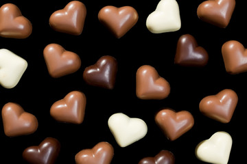 chocolate hearts on black