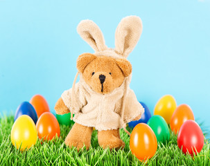 cute bear as easter bunny with colorful eggs. Decoration