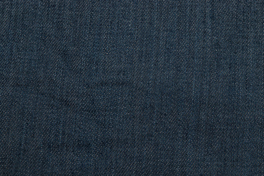 closeup of seamless dark blue denim fabric texture