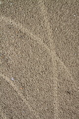 Wheels on the sand.