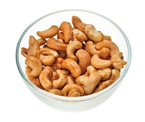 Unshelled cashew nuts in a glass bowl